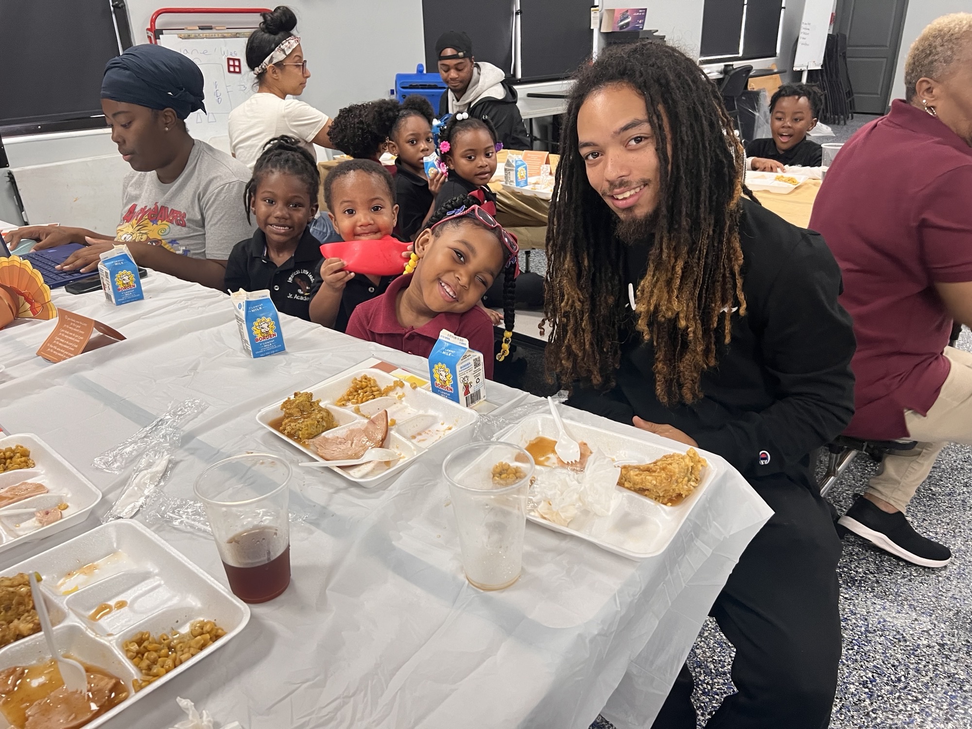 man eating with kids