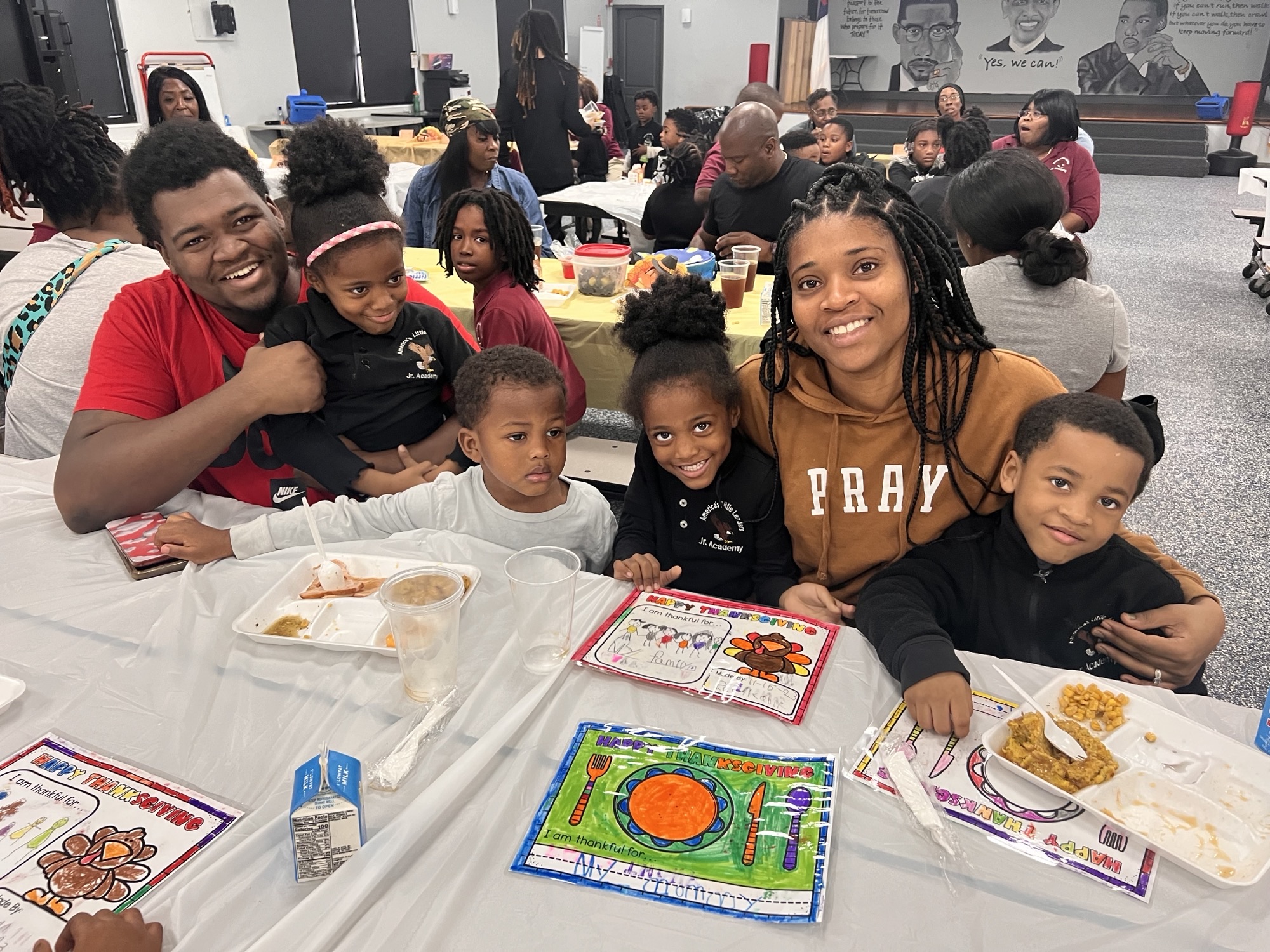 Man and Woman smiling with kids